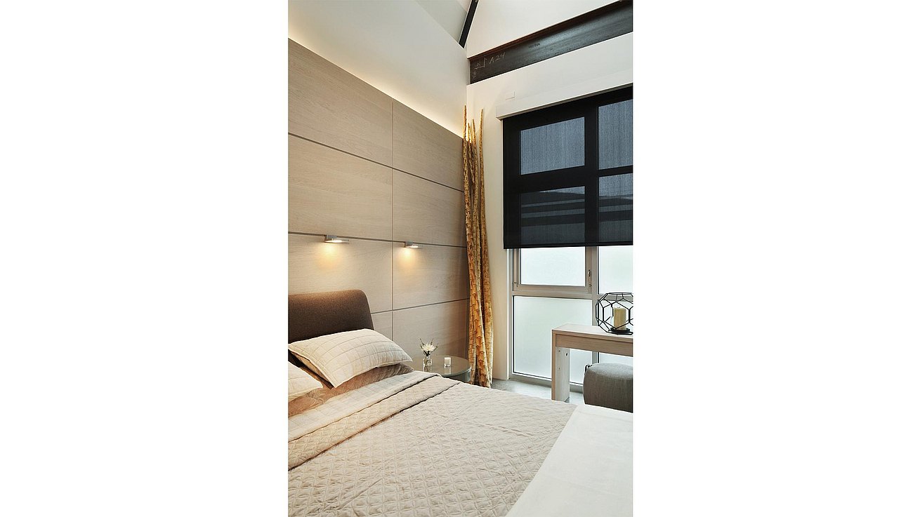 View of the bedroom with horizontal structure white oak wall panels with integrated swing lights over nightstands