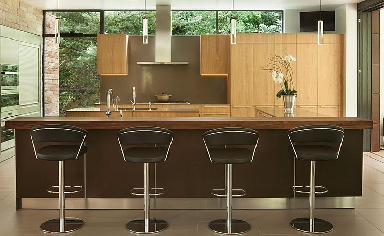 Combination of bronze aluminum base cabinets with structure natural oak finishes. Offering causal bar top seating